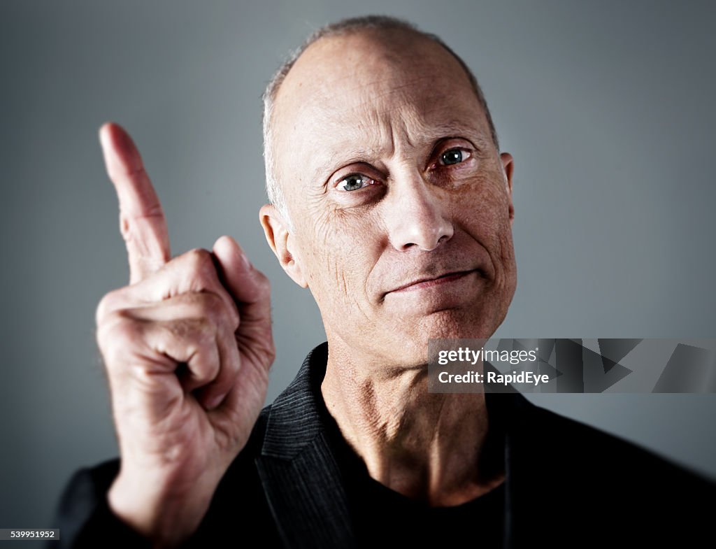 Wagging finger, serious mature man, ticking off, remonstrating, boss, manager,