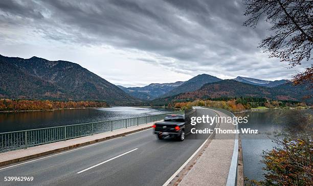 pickup  truck crossing abridge - pick up truck stock-fotos und bilder