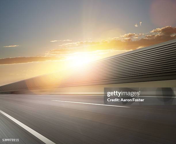 freeway sunset - road motion stock pictures, royalty-free photos & images