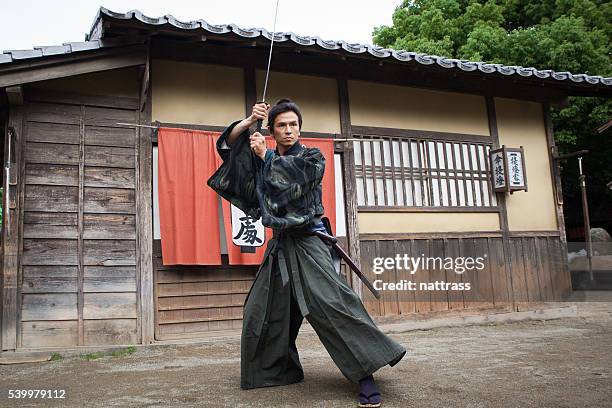 japanese samurai ready for battle - samurai sword stock pictures, royalty-free photos & images
