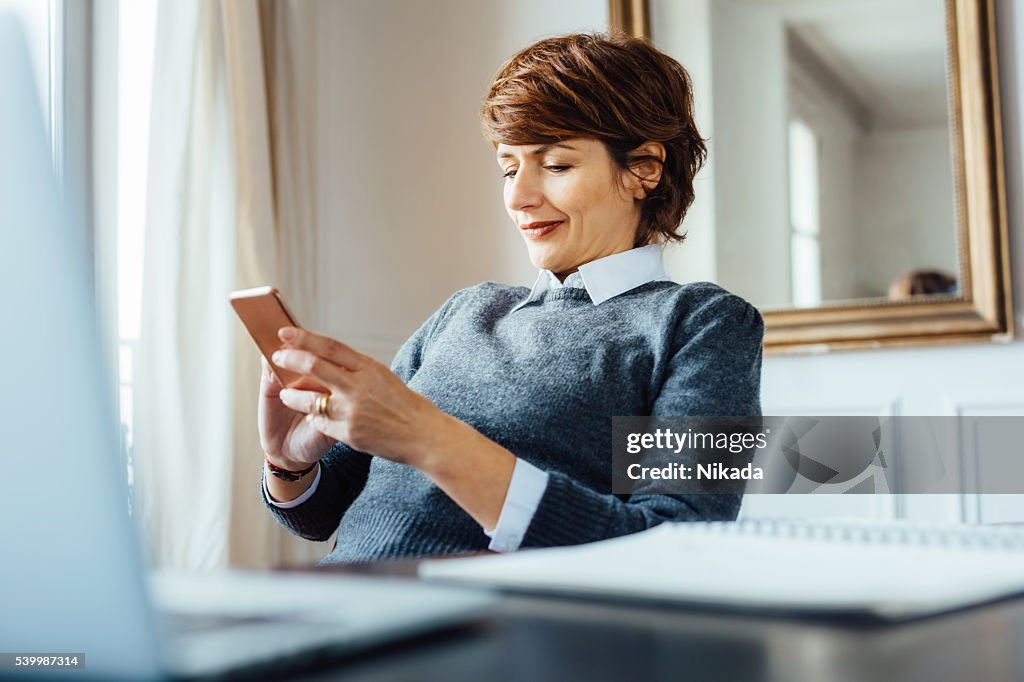 French businesswoman with mobile phone