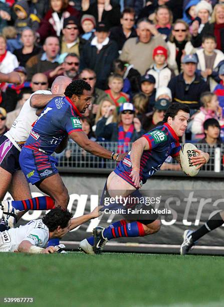 Newcastle's Jarrod Mullen has his pants pulled down by Melbourne's Billy Slater during the Round 19 NRL rugby league match between the Newcastle...