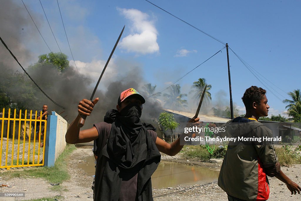 Gangs and vandals armed with machetes and slingshots patrol East Timor's capital