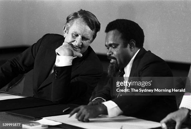 Australian Prime Minister Malcolm Fraser and Papua New Guinea Prime Minister Michael Somare sign the Torres Strait Treaty at PNG House in Clarence...