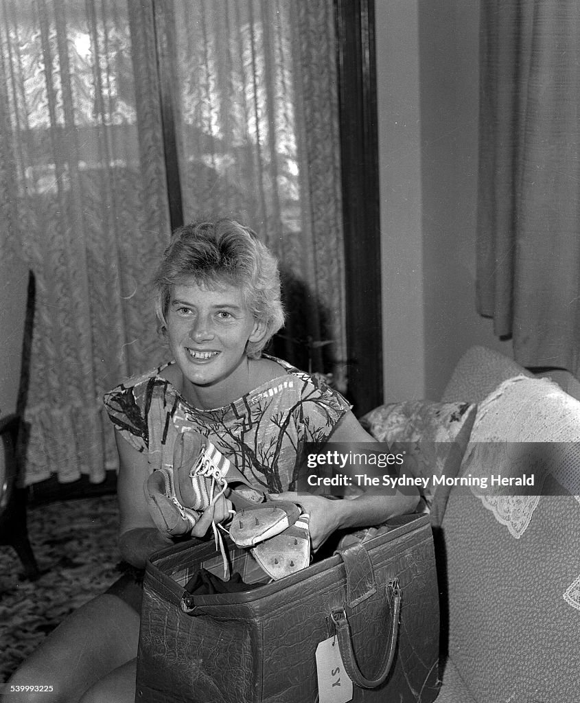 Australian athlete, Betty Cuthbert, at home with her famous running shoes, 13 M