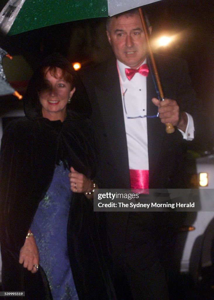 RICHARD CARLETON and wife at the wedding of James Packer, 23 October 1999. SMH