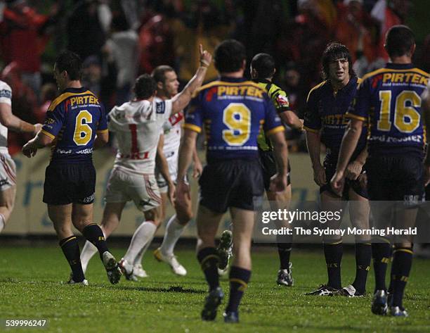 The Dragons celebrate Matt Cooper's try as the Eels' Nathan Hindmarsh wonders what happened during the NRL Round 13 rugby league match between the...