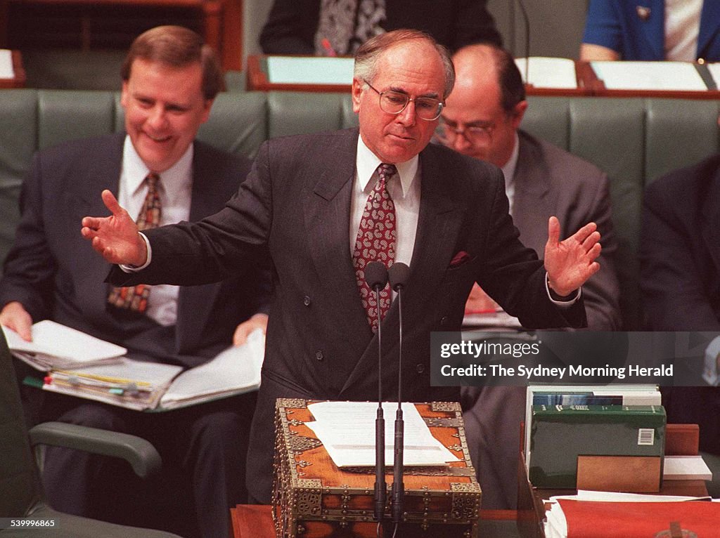 Prime Minister John Howard speaks during question time as Liberal frontbenchers