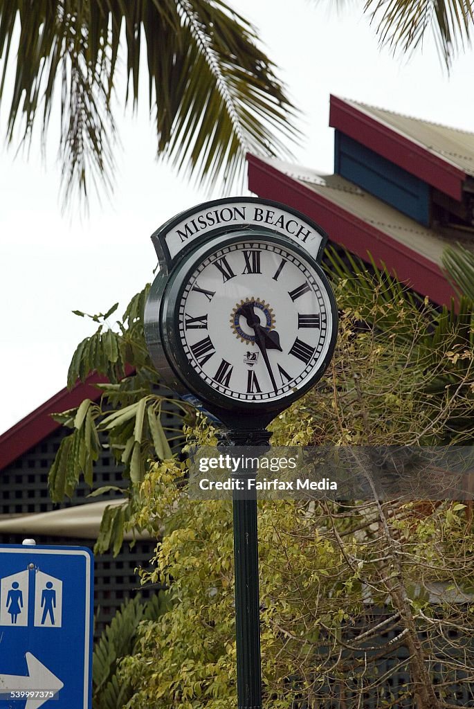 Cyclone Larry. A clock in the main street of Mission Beach, Queensland, stopped