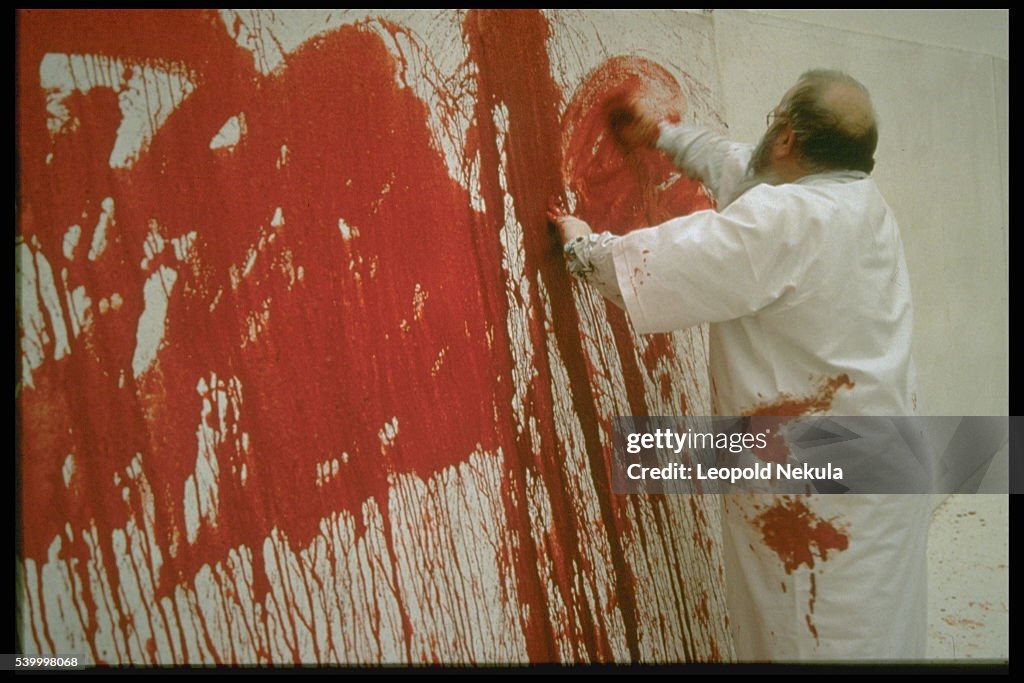 AUSTRIAN PAINTER H.NITSCH PAINTS WITH BLOOD