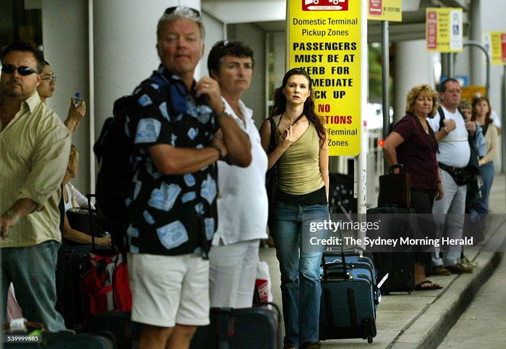Crowds of travellers waits at the pick-up zones at the Sydney Airport domestic t