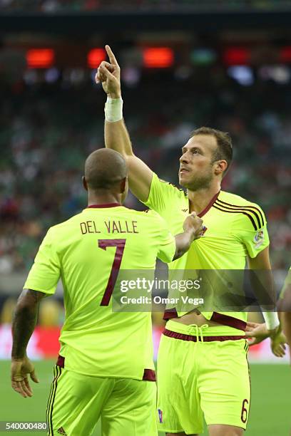 Jose Manuel Velazquez of Venezuela celebrates with teammate Yonathan Del Valle after scoring the opening goal during a group C match between Mexico...