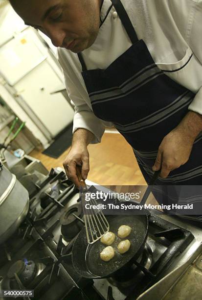 Chef Peter Conistis, from the Omega restaurant, prepares his moussaka, 30 March 2006. SMH Picture by LEE BESFORD