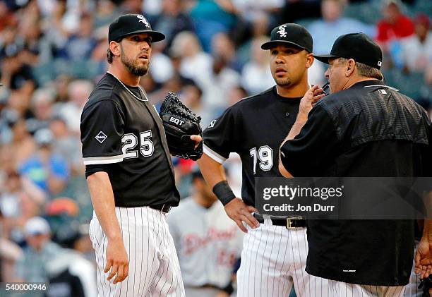 Pitching coach Don Cooper of the Chicago White Sox approaches the pitcher's mound to talk with James Shields as Jose Abreu looks on during the first...