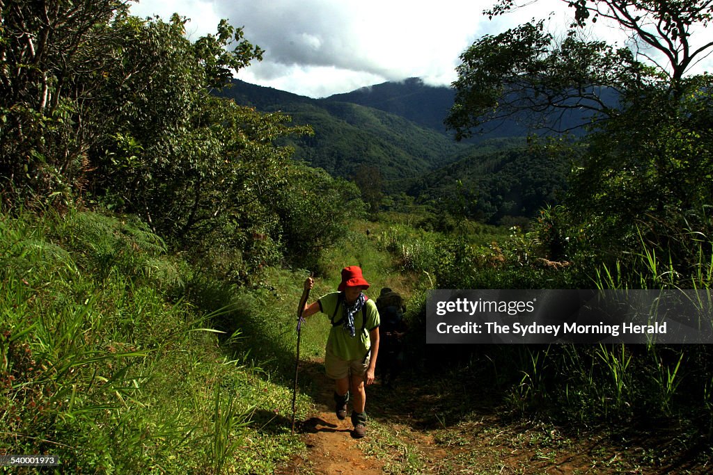 Trekkers walk to the village of Efogi Number 1, on an eight-day journey along th
