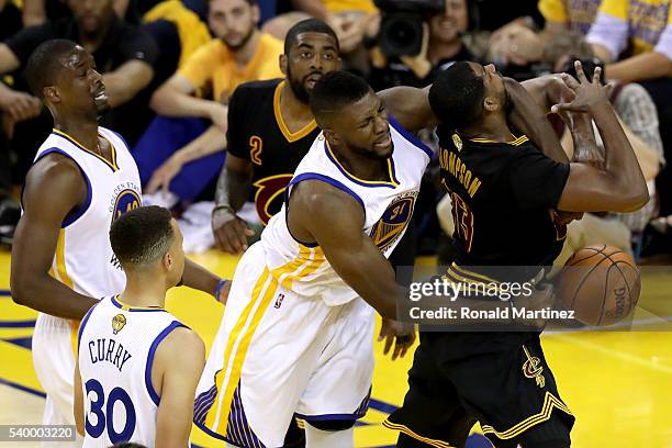 Festus Ezeli of the Golden State Warriors fouls Tristan Thompson of the Cleveland Cavaliers in the first half in Game 5 of the 2016 NBA Finals at...