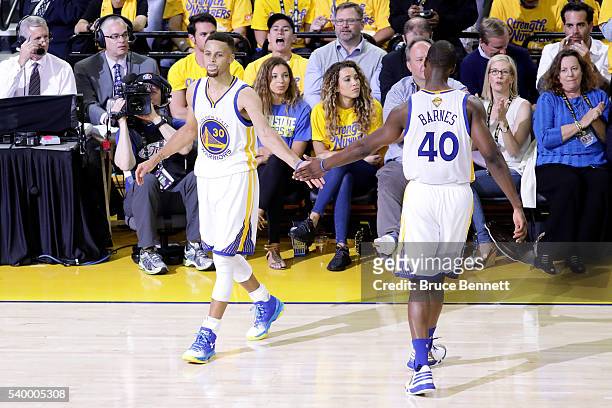 Stephen Curry and Harrison Barnes of the Golden State Warriors reacts during the first quarter against the Cleveland Cavaliers in Game 5 of the 2016...