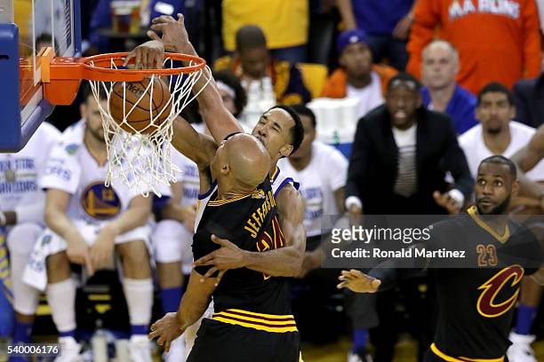 Shaun Livingston of the Golden State Warriors dunks the ball over Richard Jefferson of the Cleveland Cavaliers during the second quarter in Game 5 of...