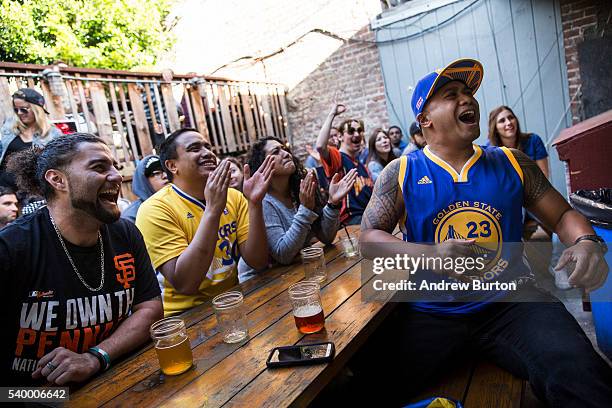 Golden State Warriors fans watch the first quarter of Game 5 of the 2016 NBA Finals between the Warriors and the Cleveland Cavaliers on June 13, 2016...