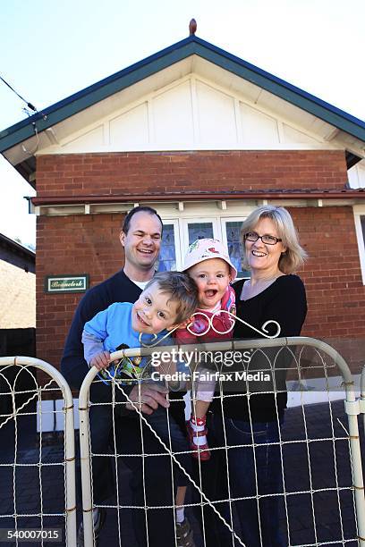 Allan Owens and Belinda Newman with children Benjamin and Charlotte, at their new house in Lewisham, Sydney.