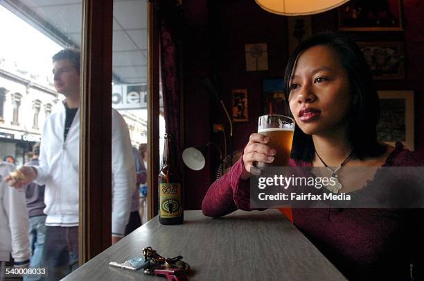 Young beer drinker Lisa Pham sinks another beer at Cafe Bebida on Smith St. Fitzroy. For story on the changing face on beer consumption. 17 June...