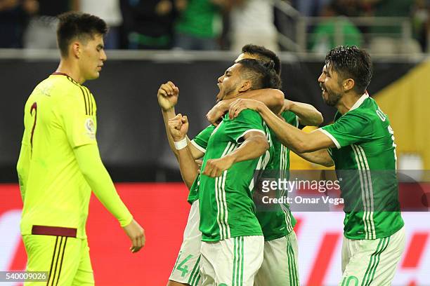 Jesus Manuel Corona of Mexico celebrates with teammates after scoring the first goal of his team during a group C match between Mexico and Venezuela...