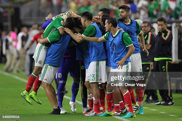 Jesus Manuel Corona of Mexico celebrates with teammates after scoring the first goal of his team during a group C match between Mexico and Venezuela...