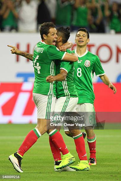 Jesus Manuel Corona of Mexico celebrates with teammates Javier Hernandez and Hirving Lozano after scoring the first goal of his team during a group C...