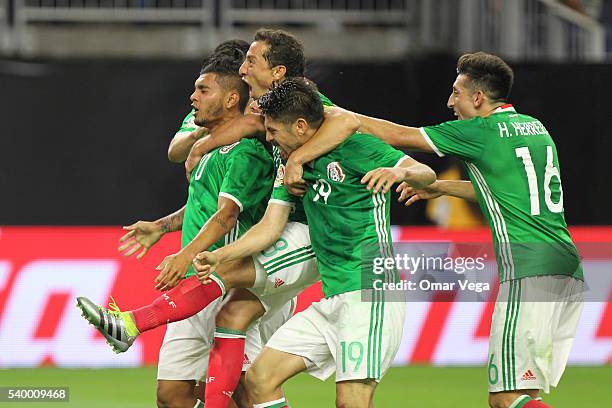 Jesus Manuel Corona of Mexico celebrates with teammates after scoring the first goal of his team during a group C match between Mexico and Venezuela...