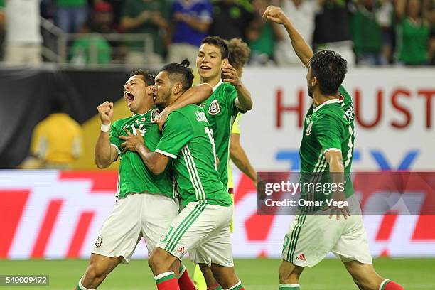 Jesus Manuel Corona of Mexico celebrates with teammates after scoring the first goal of his team during a group C match between Mexico and Venezuela...