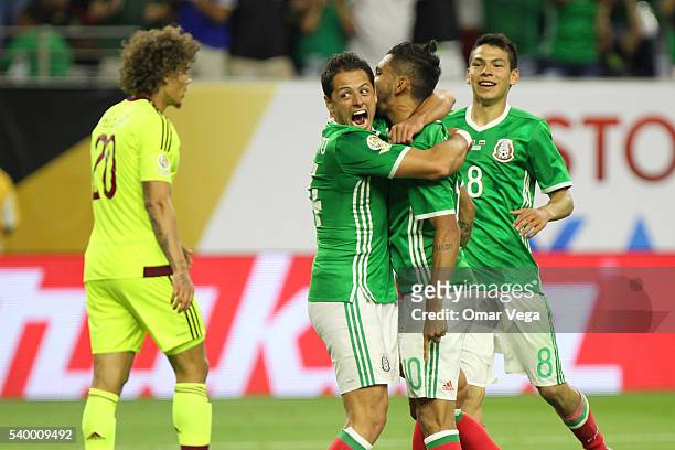 Jesus Manuel Corona of Mexico celebrates with teammates Javier Hernandez and Hirving Lozano after scoring the first goal of his team during a group C...