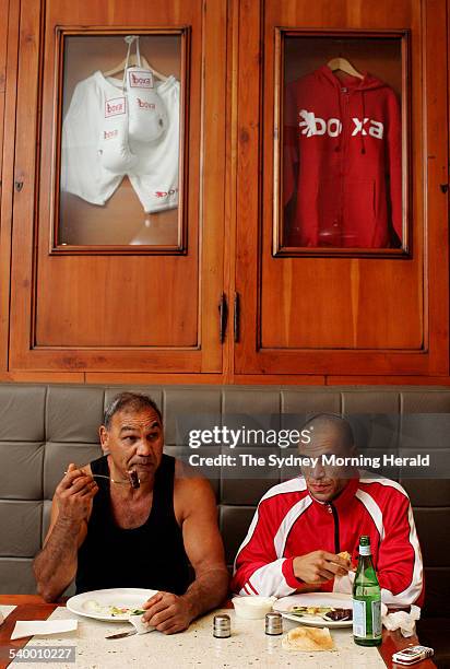 Tony, left, and Anthony Mundine share a meal at Boxa Bar in Sydney, 20 April 2006. SMH Picture by PAUL MILLER