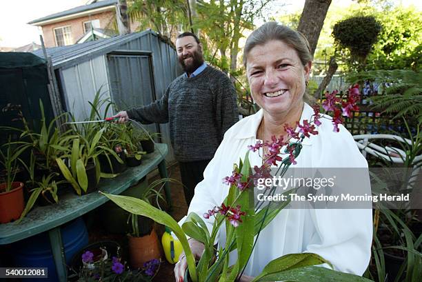 Debbi Wares and her husband Garry, in their garden, have been growing orchids for years, 30 May 2006. SMH Picture by NARELLE AUTIO