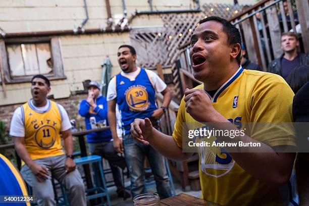 Golden State Warriors fans celebrate while watching Game 5 of the 2016 NBA Finals between the Warriors and the Cleveland Cavaliers on June 13, 2016...