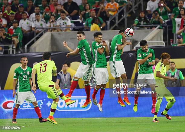 The Mexico defense blocks a shot from Luis Manuel Seijas of Venezuela during the 2016 Copa America Centenario Group match between Mexico and...