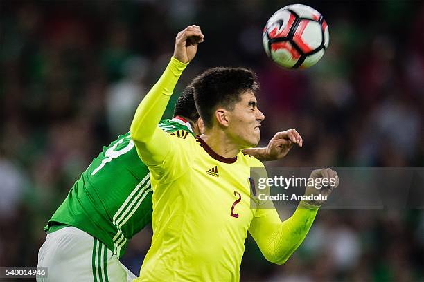 Oribe Peralta of Mexico struggle for the ball against Wilker Angel of Venezuela during the 2016 Copa America Centenario Group C match between Mexico...