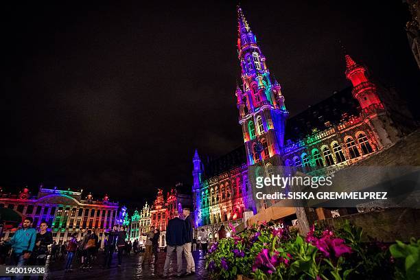 The city hall and the heritage buildings on the Brussels Grand Place/Grote Markt lit up in the colors of the LGBT rainbow flag on 13 June 2016 in...