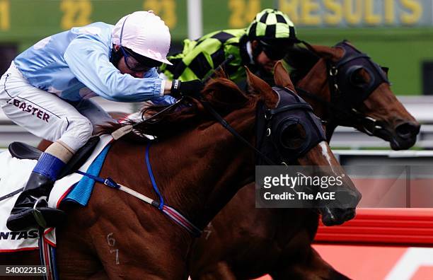 Jockey Stephen Baster drives Lolita Star past stablemate Lan Kwai Fong in Race 5, The Wakeful Stakes, during the Spring Racing Carnival at Flemington...