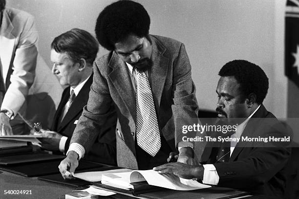 Prime Minister Malcolm Fraser and Papua New Guinea Prime Minister Michael Somare sign the Torres Strait Treaty at PNG House in Clarence Street,...