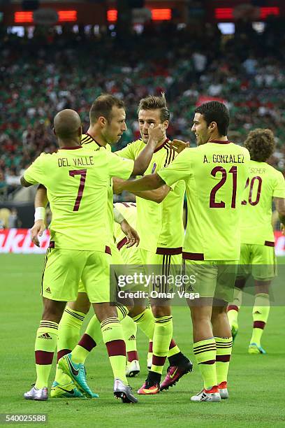 Jose Manuel Velazquez of Venezuela celebrates with teammates after scoring the opening goal during a group C match between Mexico and Venezuela at...