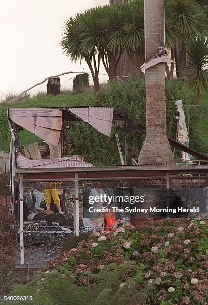 Forensic police officers in the ruins of the Seascape Guesthouse, where gunman Martin Bryant retreated after shooting and killing 35 people during...