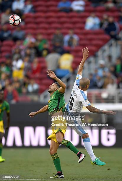 Jobi McAnuff of Jamaica hits a header ad collides with Maximiliano Pereira of Uruguay during the 2016 Copa America Centenario Group match play...