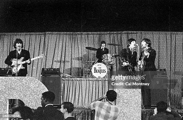 The Beatles perform at Dodger Stadium on August 28, 1966 in Los Angeles, California.