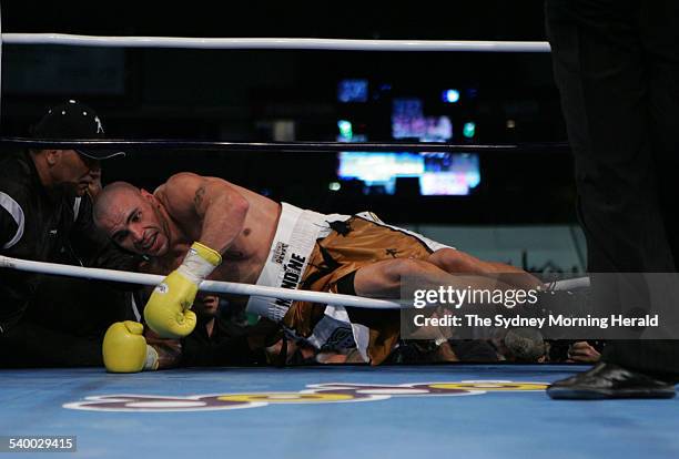 Anthony Mundine vs Danny Green at Aussie Stadium. Mundine gets pushed through the ropes, 17 May 2006. SMH Picture by CRAIG GOLDING