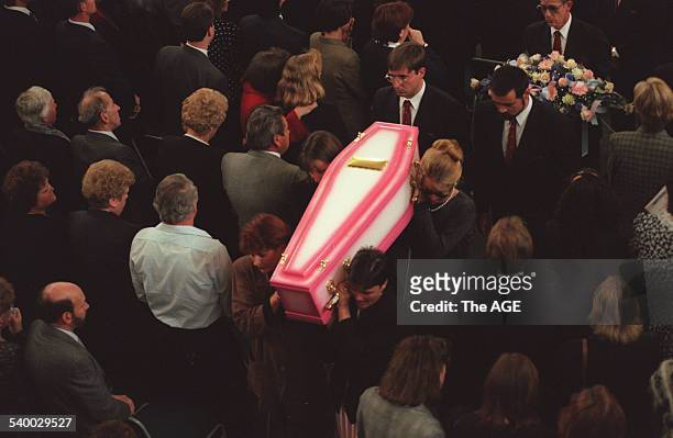 Elevated view of pallbearers as they carry a coffin out of a church during the funeral for Nanette Mikac and her two daughters, Alannah and Madeline,...