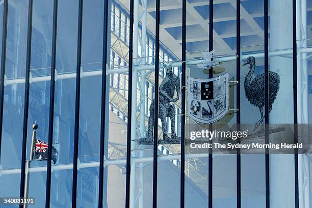 The Australian coat of arms with the Australian flag reflected in the window at the High Court in Canberra on 4 May 2006 during the challenge to the...