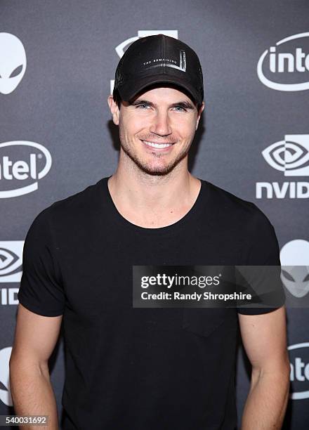 Actor Robbie Amell checks out the latest virtual reality and gaming technology at a VIP Alienware Party during E3, in partnership with NVIDIA and...