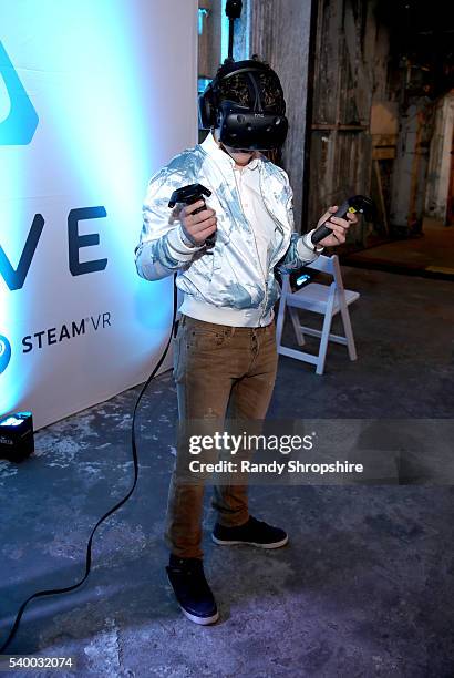Actor Nolan Gould checks out the latest virtual reality and gaming technology at a VIP Alienware Party during E3, in partnership with NVIDIA and...