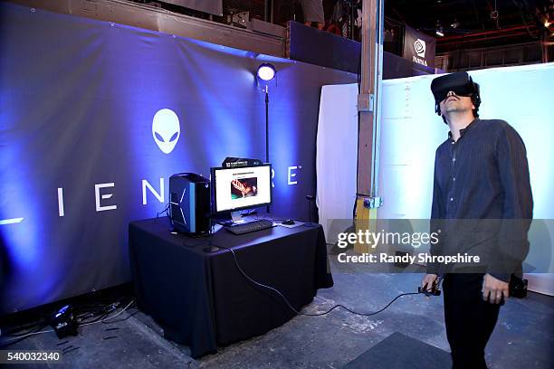 Actor Geoffrey Arend checks out the latest virtual reality and gaming technology at a VIP Alienware Party during E3, in partnership with NVIDIA and...