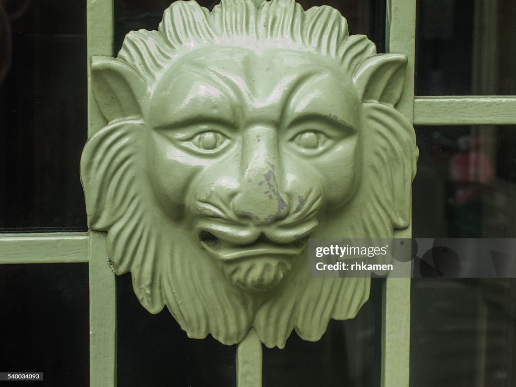 Lion on door grille, Marylebone, London